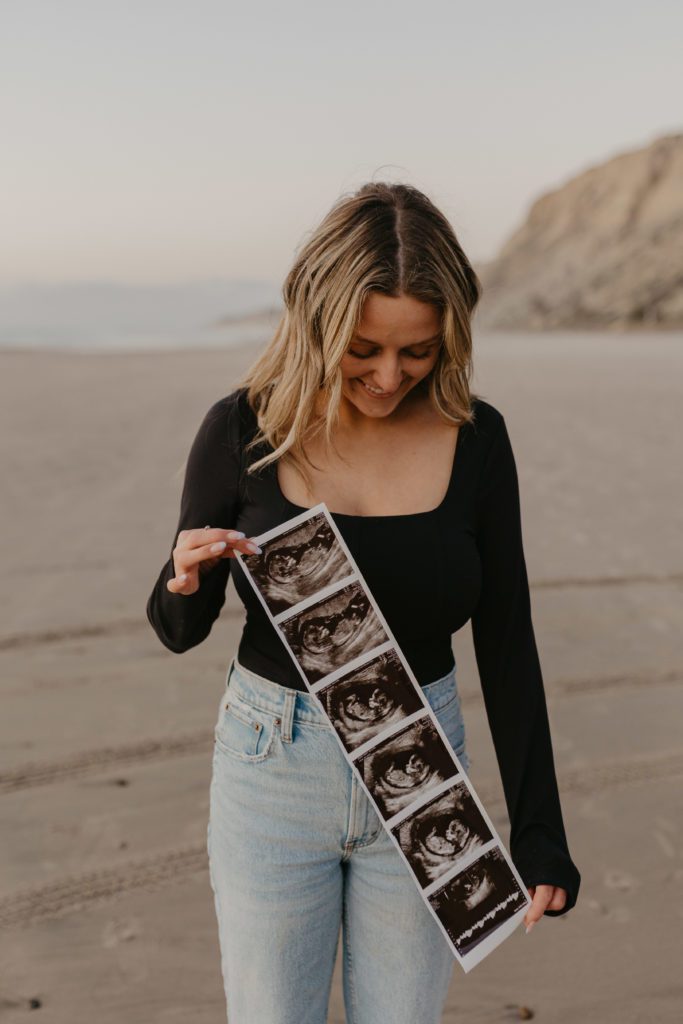 mom holding up a pregnancy ultrasound